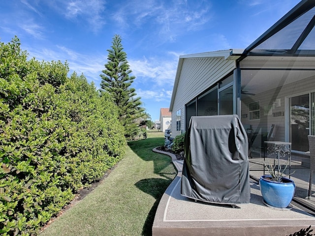 view of yard featuring a lanai