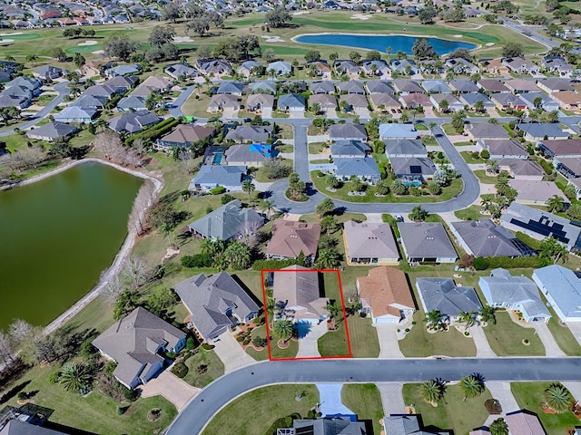 bird's eye view featuring a water view, a residential view, and golf course view