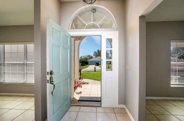 tiled entryway with baseboards