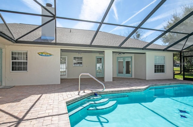 pool with a patio, french doors, a lanai, and a ceiling fan