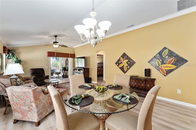 dining room with ornamental molding, light wood-type flooring, and visible vents