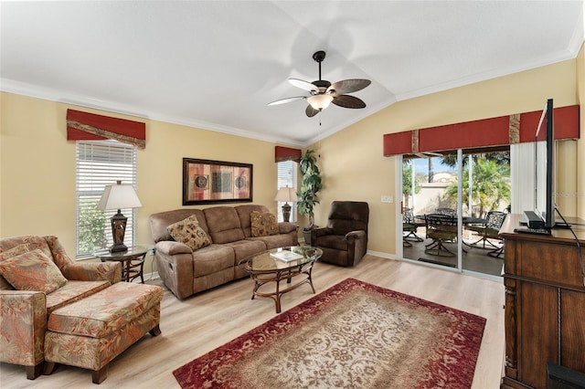 living room featuring ceiling fan, crown molding, vaulted ceiling, and wood finished floors