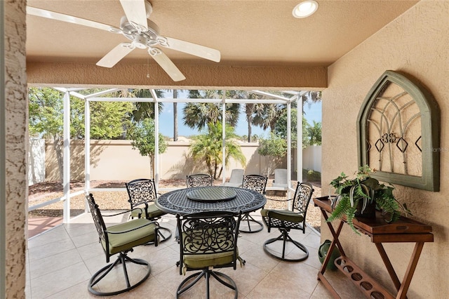 sunroom / solarium with a ceiling fan and a wealth of natural light