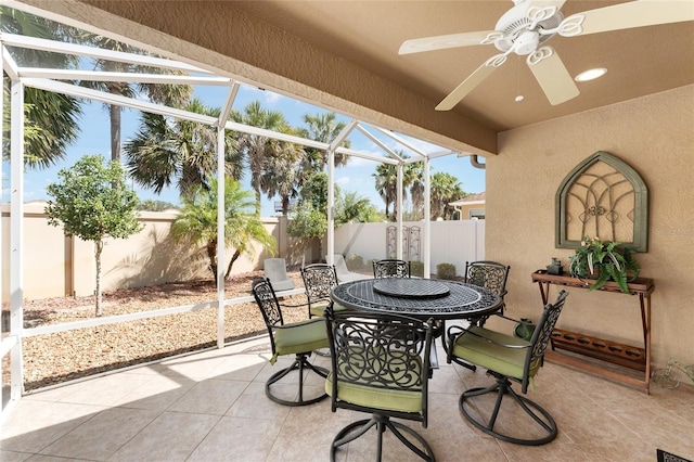 sunroom featuring ceiling fan