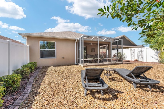 rear view of house featuring a patio area, a fenced backyard, ceiling fan, and stucco siding