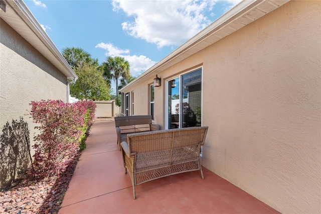 view of patio / terrace featuring fence