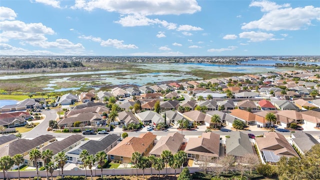 aerial view with a residential view and a water view