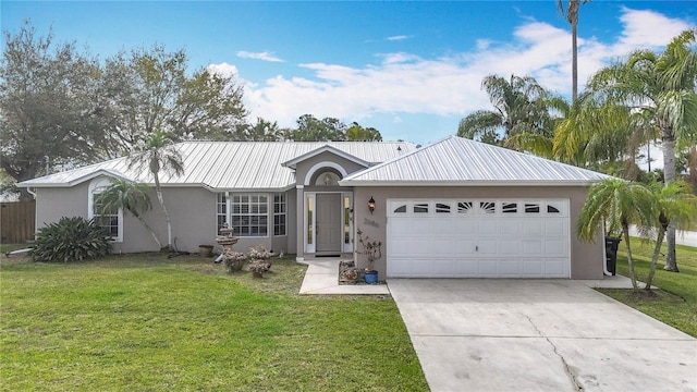 single story home featuring metal roof, concrete driveway, a front yard, and stucco siding