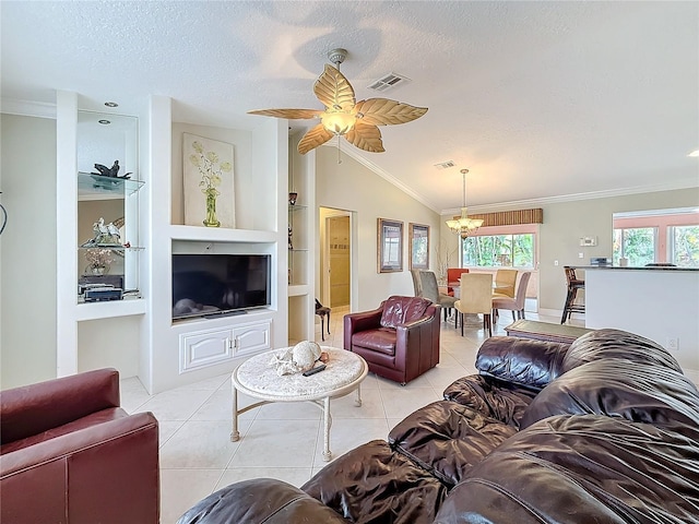 living area featuring light tile patterned floors, a textured ceiling, built in features, and a wealth of natural light