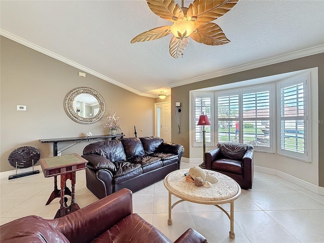 living area featuring ornamental molding, ceiling fan, a textured ceiling, and tile patterned floors