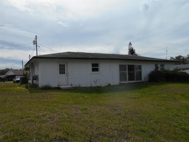 view of property exterior with a yard