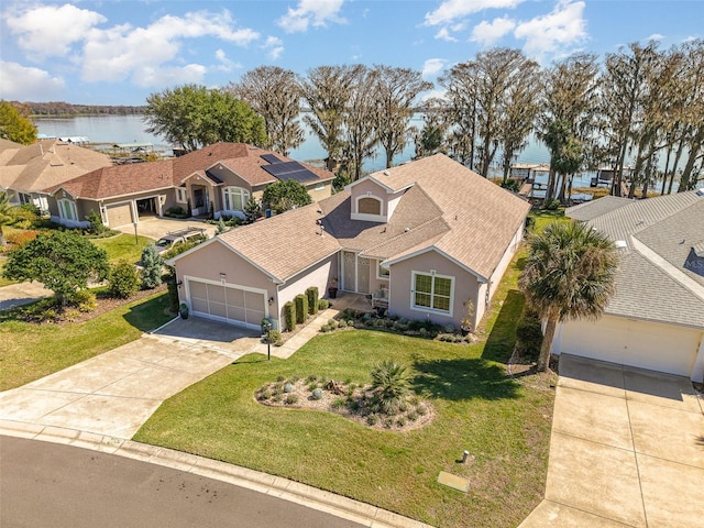 aerial view with a residential view and a water view