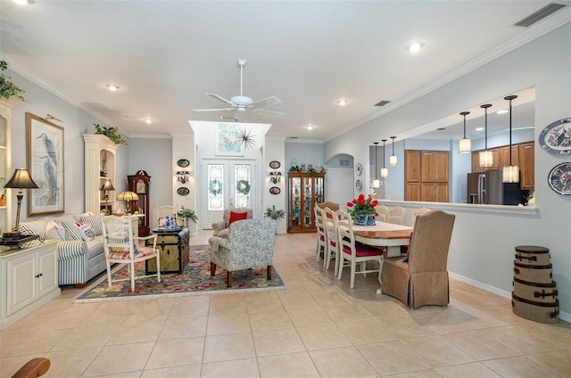 interior space featuring arched walkways, light tile patterned flooring, visible vents, and crown molding