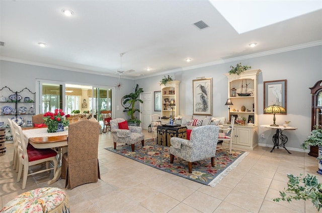 living room with ornamental molding, a skylight, visible vents, and light tile patterned floors