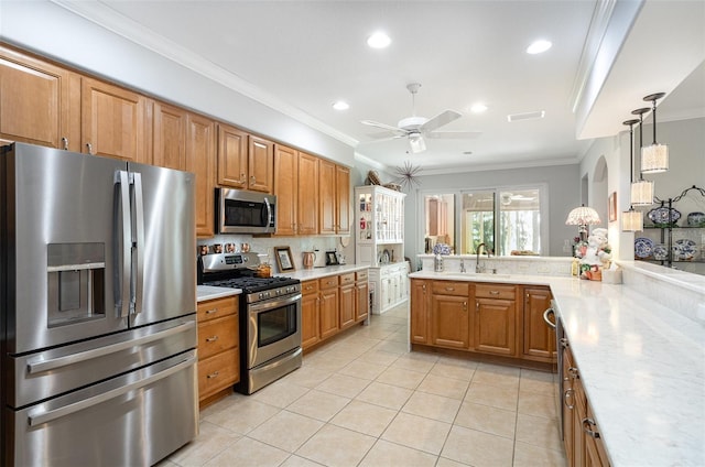 kitchen with crown molding, light tile patterned floors, light countertops, visible vents, and appliances with stainless steel finishes