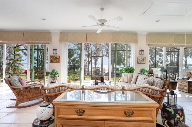 sunroom with a wealth of natural light and ceiling fan