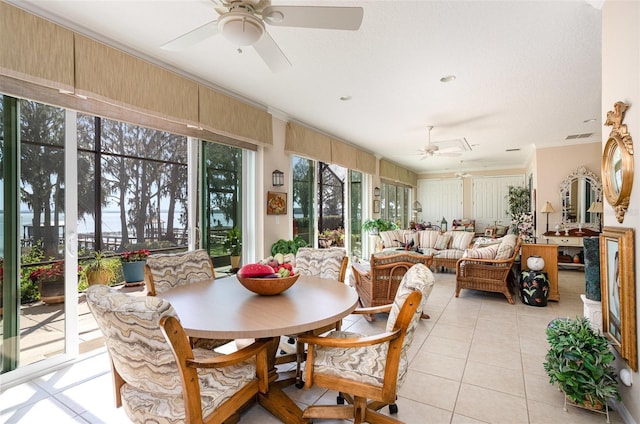 sunroom / solarium featuring a ceiling fan and visible vents