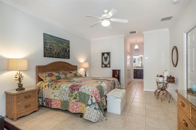 bedroom featuring visible vents, crown molding, ensuite bathroom, and light tile patterned flooring