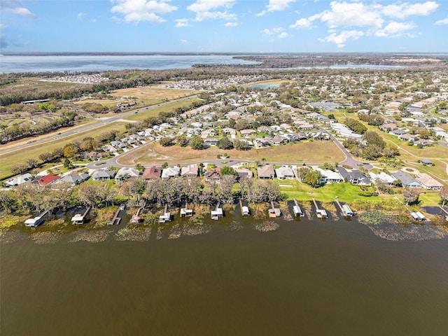 birds eye view of property featuring a residential view and a water view