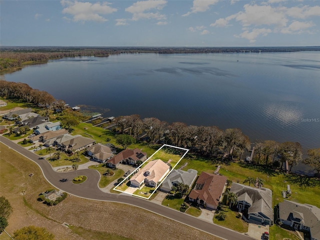 aerial view featuring a residential view and a water view