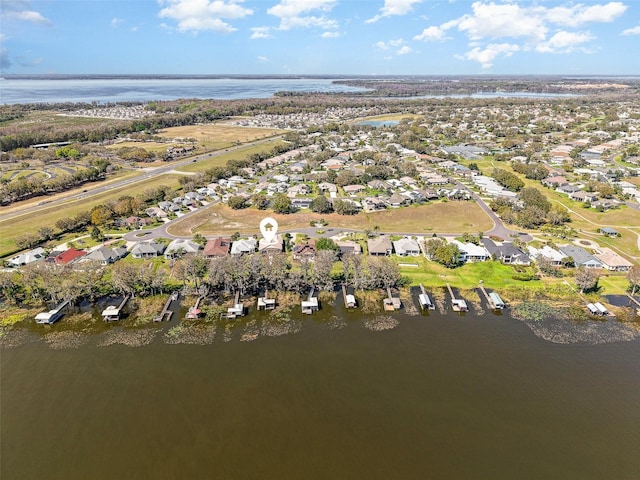 bird's eye view featuring a water view and a residential view