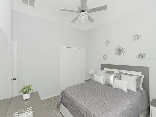 carpeted bedroom with baseboards, visible vents, and a ceiling fan