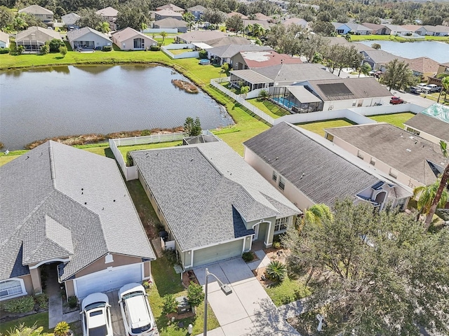 birds eye view of property featuring a residential view and a water view