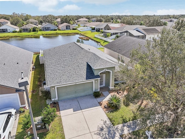 aerial view with a water view and a residential view