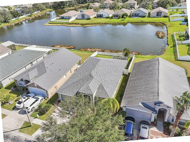 aerial view with a water view and a residential view