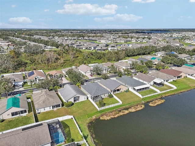 bird's eye view featuring a residential view and a water view