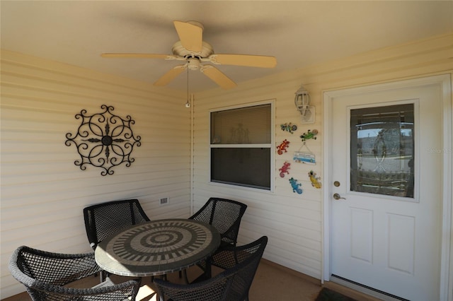 exterior space featuring a ceiling fan