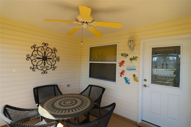 exterior space with a ceiling fan and outdoor dining space