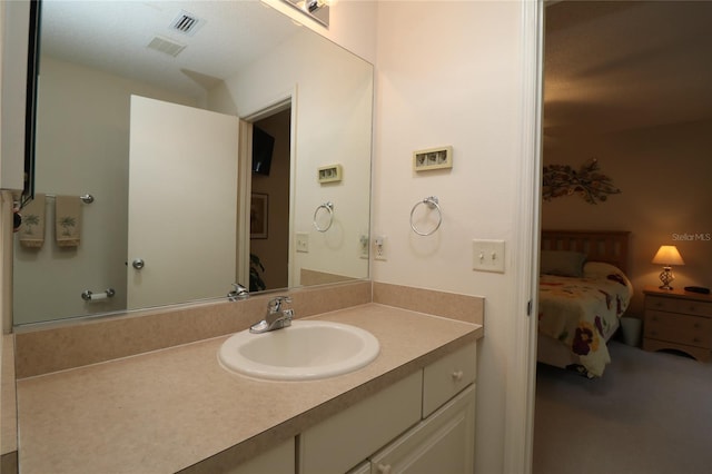 bathroom featuring visible vents and vanity