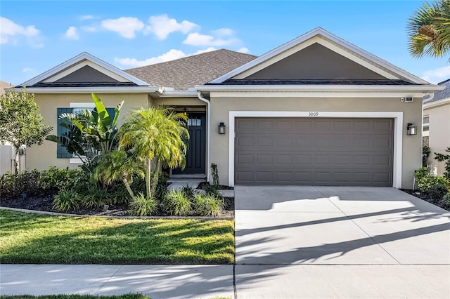 single story home featuring driveway, a garage, a shingled roof, a front lawn, and stucco siding