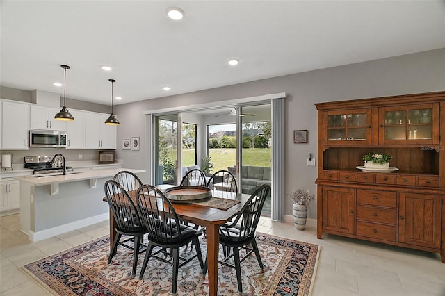 dining space featuring recessed lighting, baseboards, and light tile patterned floors