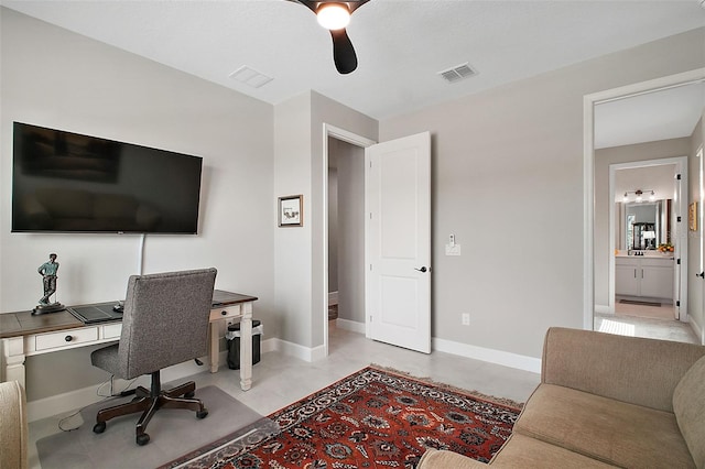 office space with visible vents and baseboards