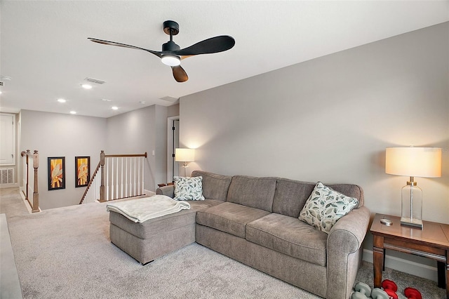 carpeted living area with ceiling fan, visible vents, and recessed lighting