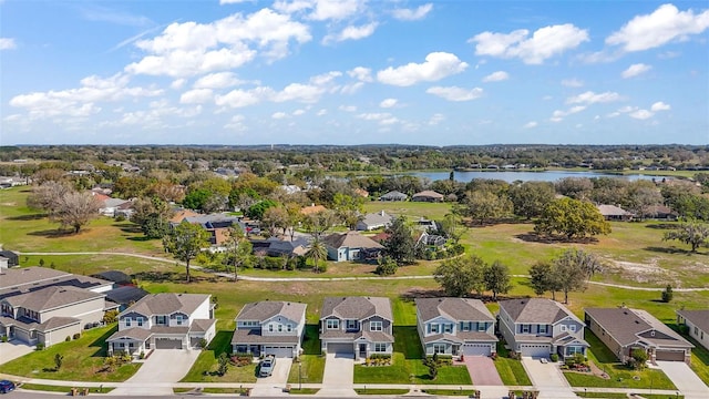 aerial view featuring a water view and a residential view