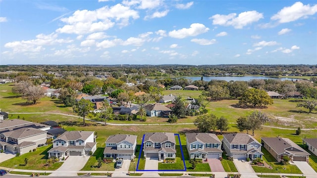 aerial view featuring a water view and a residential view