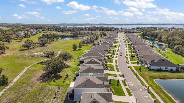 bird's eye view featuring a water view and a residential view