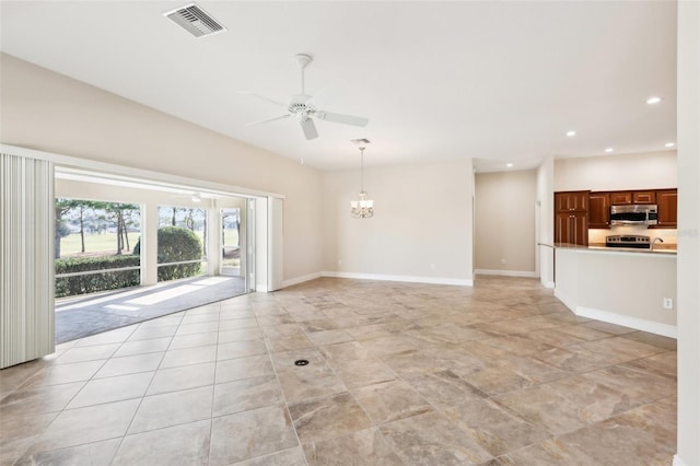 unfurnished living room featuring light tile patterned floors, recessed lighting, ceiling fan with notable chandelier, visible vents, and baseboards