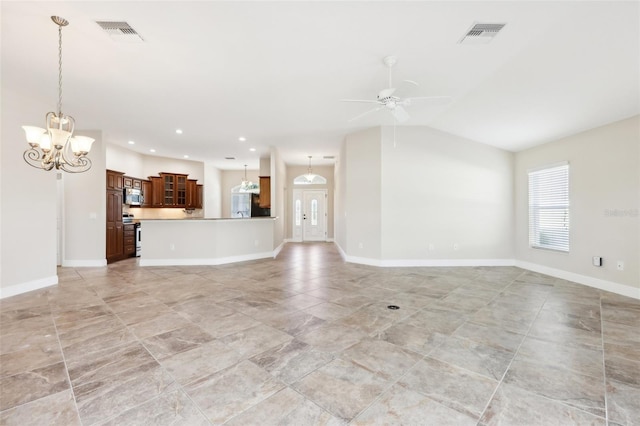 unfurnished living room with lofted ceiling, visible vents, baseboards, and ceiling fan with notable chandelier