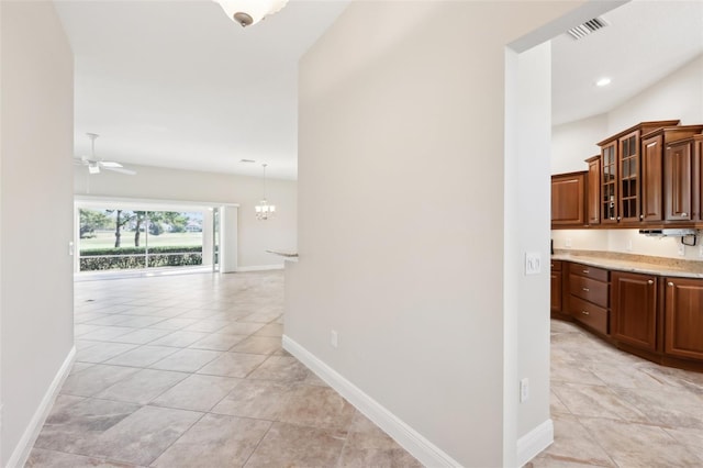 corridor featuring recessed lighting, baseboards, visible vents, and light tile patterned flooring