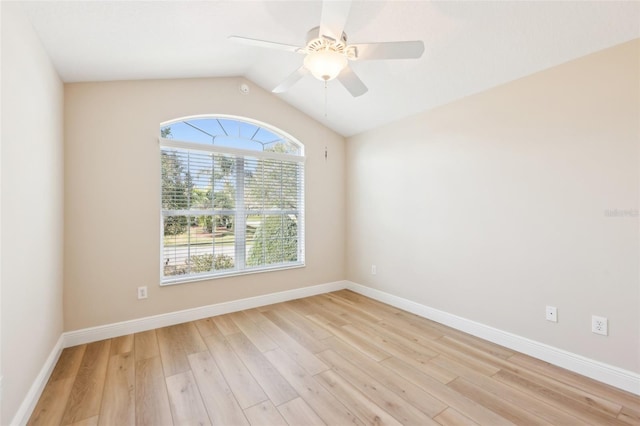 unfurnished room featuring baseboards and light wood finished floors