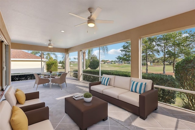 sunroom featuring ceiling fan