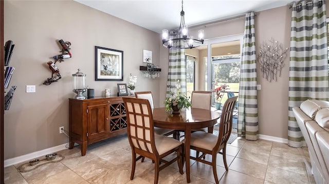 26747 White Plains Way, Leesburg, FL 34748 - dining space with light tile patterned floors, a chandelier, and baseboards
