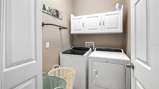 26747 White Plains Way, Leesburg, FL 34748 - clothes washing area with cabinet space and washing machine and clothes dryer