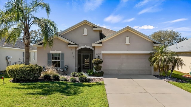26747 White Plains Way, Leesburg, FL 34748 - view of front of home with driveway, stucco siding, a front lawn, and a garage