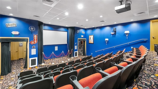 26747 White Plains Way, Leesburg, FL 34748 - cinema room featuring visible vents, a drop ceiling, and carpet floors