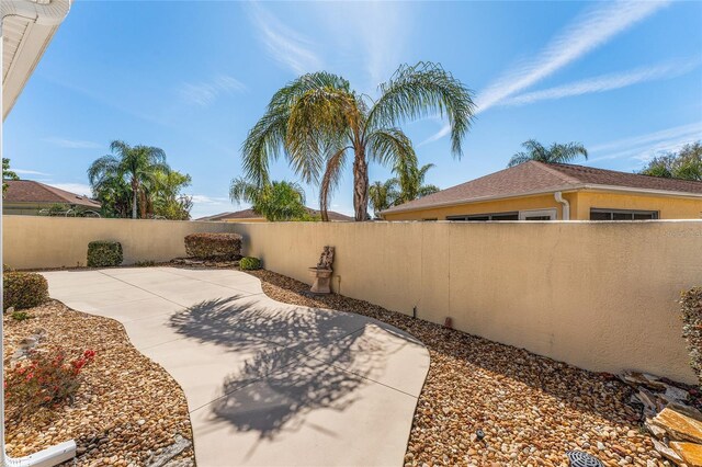 1202 San Bernardo Rd, The Villages, FL 32162 - view of yard featuring fence private yard and a patio area
